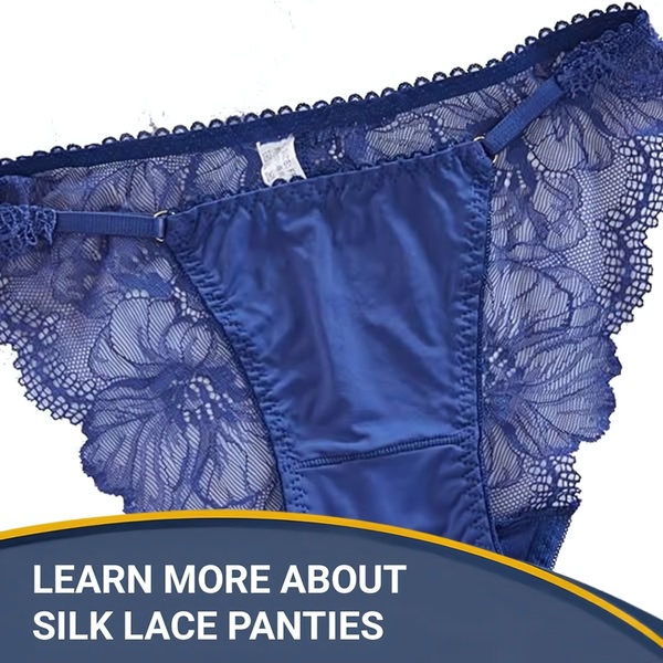 A focused, high-contrast close-up shot of blue silk and lace lingerie, emphasizing texture and design detail against a clean background.